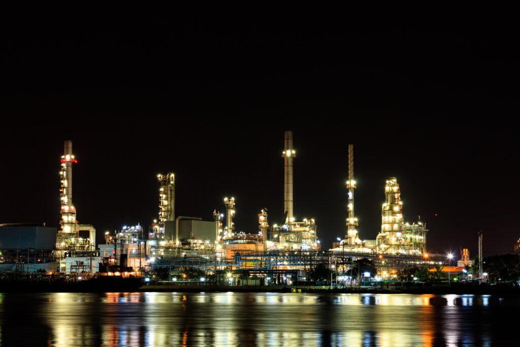 Oil refinery at night with reflection